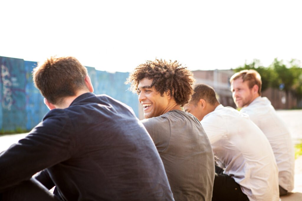 four friends sitting and talking